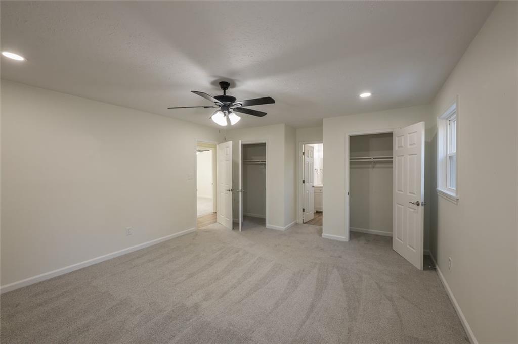 5081 Hubert Drive Powder Springs, GA 30127 - Photo 25 of 32 a view of an empty room with a chandelier fan