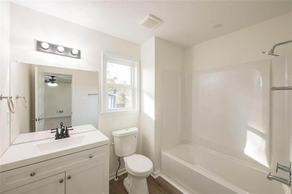 5081 Hubert Drive Powder Springs, GA 30127 - Photo 27 of 32 a bathroom with a sink a toilet and a bathtub