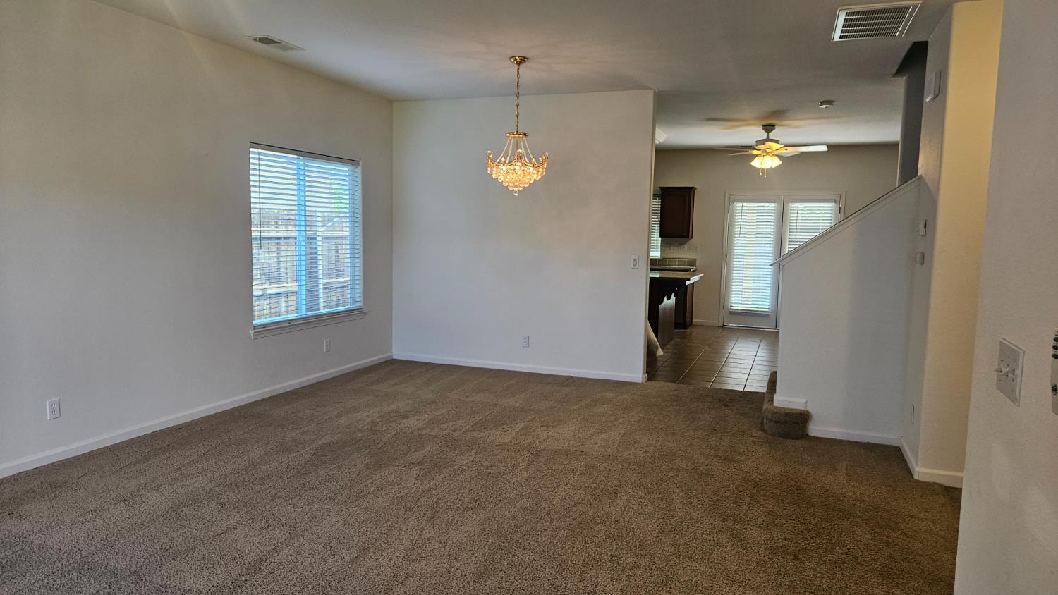 580 West Sunset Street Kingsburg, CA 93631 - Photo 3 of 12 a view of an empty room with a window