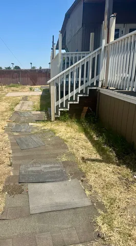 a view of a house with a yard from a balcony