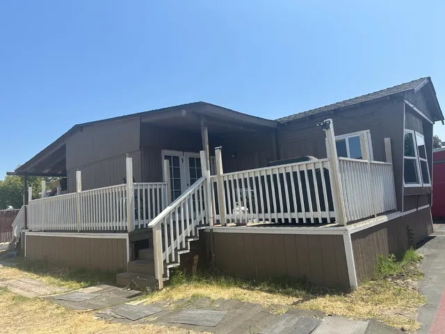 a view of balcony with wooden floor