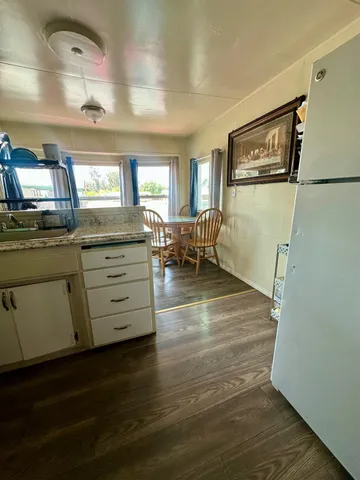 a room with hard wood floors and a window