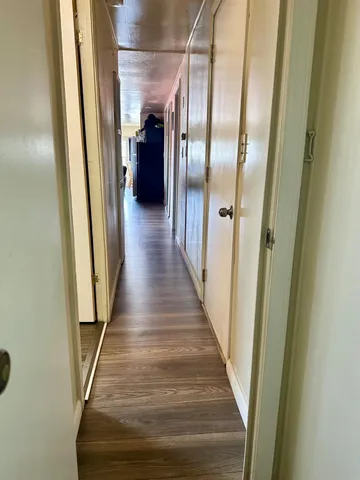 a view of gallery with wooden floor