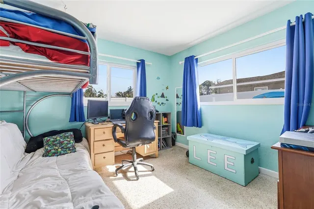 a bedroom with a bed and a dresser