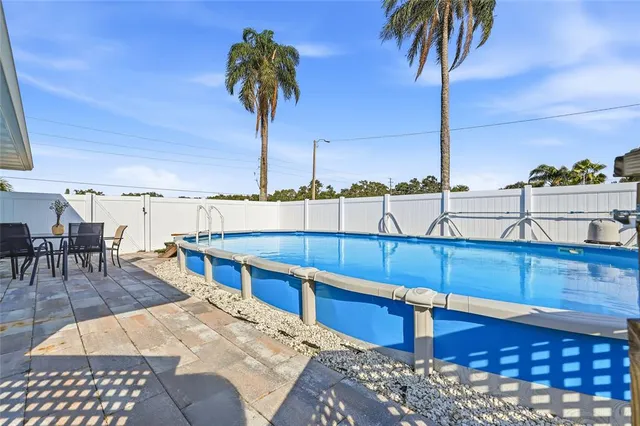 a view of a backyard with furniture