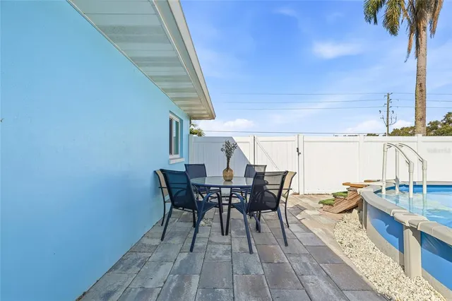 a view of a house with backyard and porch