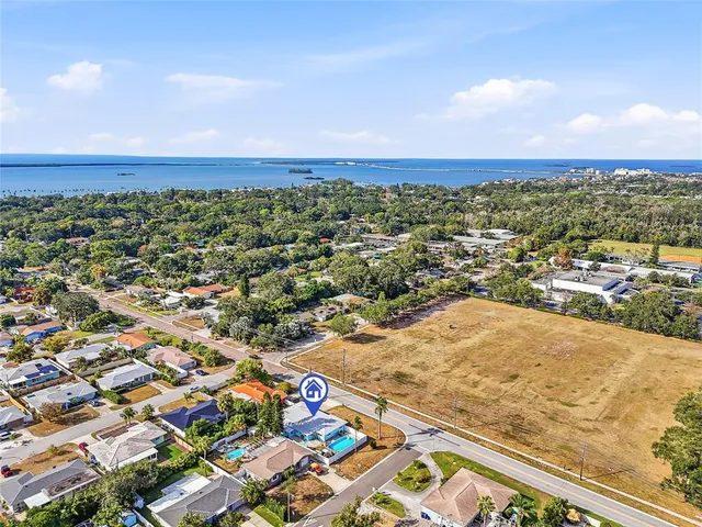 an aerial view of residential building and ocean view