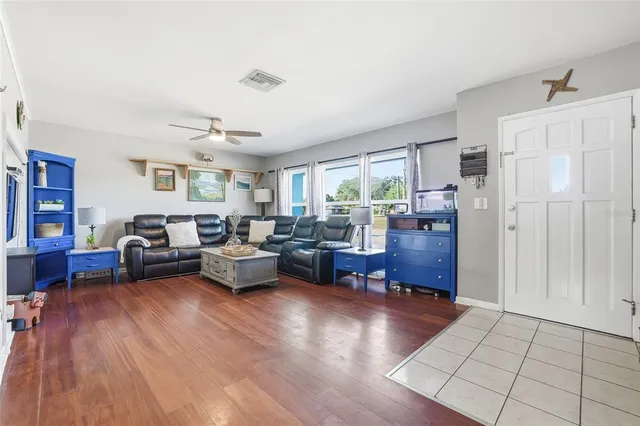 a living room with furniture fireplace and a flat screen tv