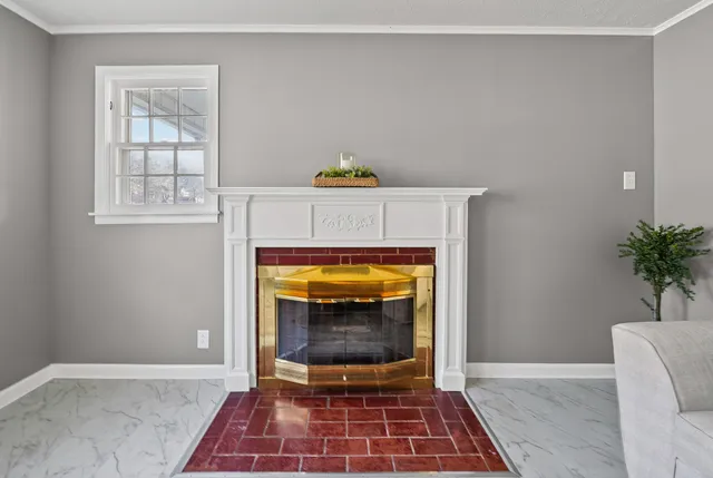 a view of a bedroom with a chandelier fan and a ceiling fan