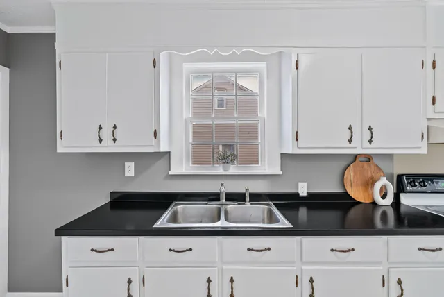 wooden floor with windows and closet