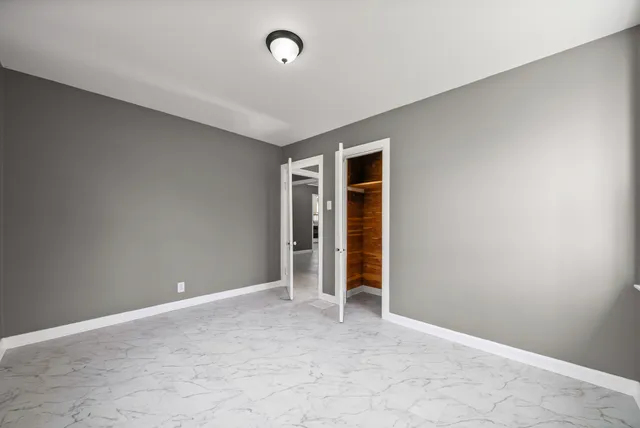 a bathroom with a sink toilet and a mirror