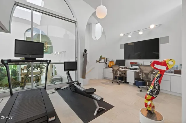 a view of a balcony with city and ocean view