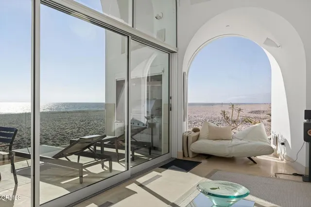 a view of a dining room with furniture and a window