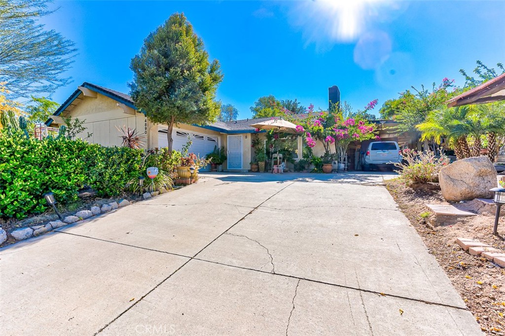 4890 Crest Avenue Riverside, CA 92503 - Photo 1 of 1 a front view of a house with a yard
