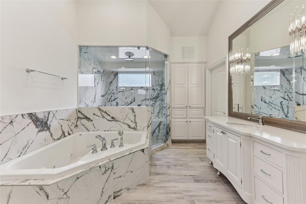 2203 Court Del Rey Round Rock, TX 78681 - Photo 14 of 35 Bathroom featuring a marble finish shower, vanity, and a garden tub