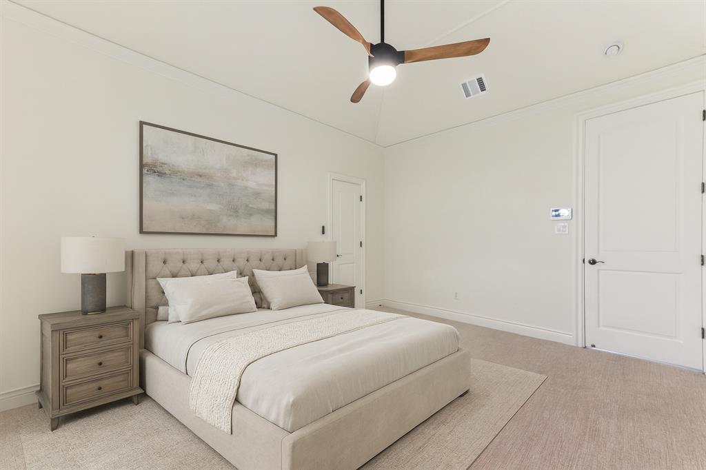 2203 Court Del Rey Round Rock, TX 78681 - Photo 21 of 35 Carpeted bedroom featuring a ceiling fan, crown molding, and vaulted ceiling