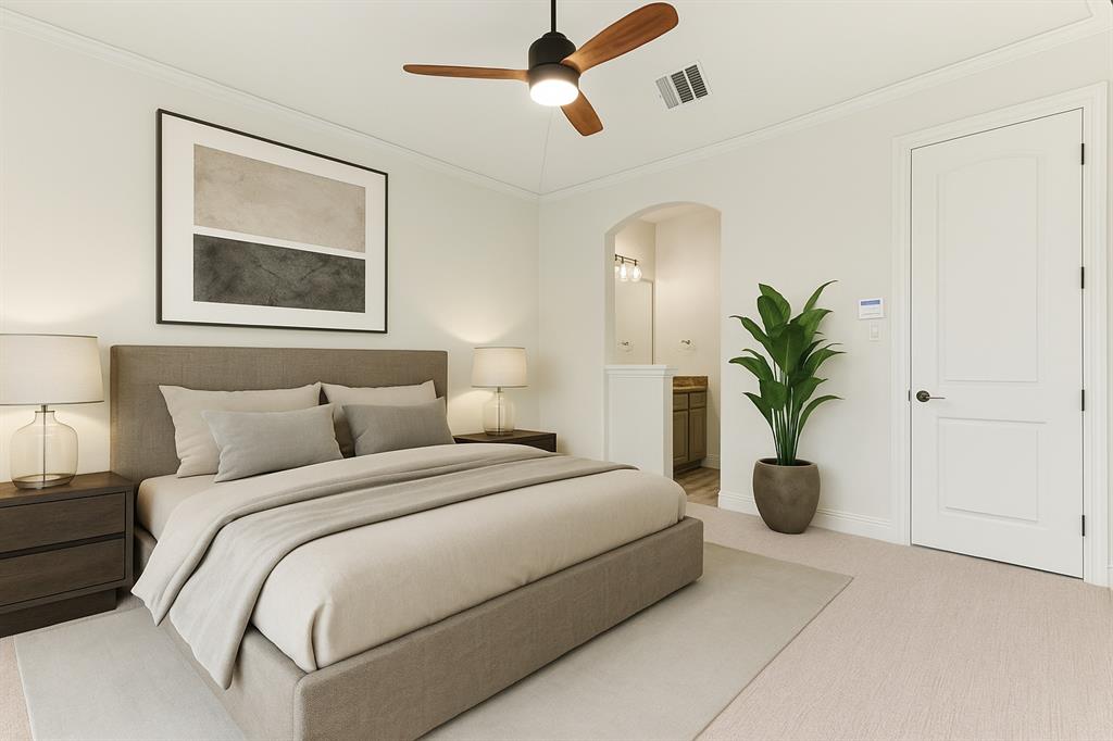 2203 Court Del Rey Round Rock, TX 78681 - Photo 23 of 35 Carpeted bedroom with crown molding, arched walkways, connected bathroom, and ceiling fan