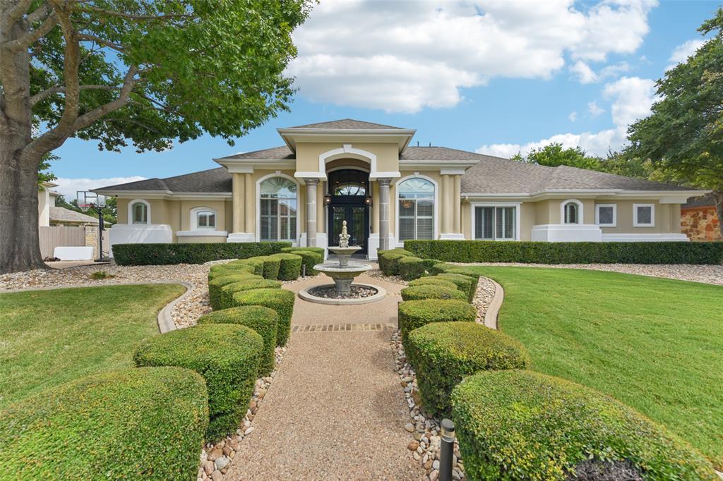 2203 Court Del Rey Round Rock, TX 78681 - Photo 3 of 35 View of front of property with stucco siding, a front lawn, and french doors