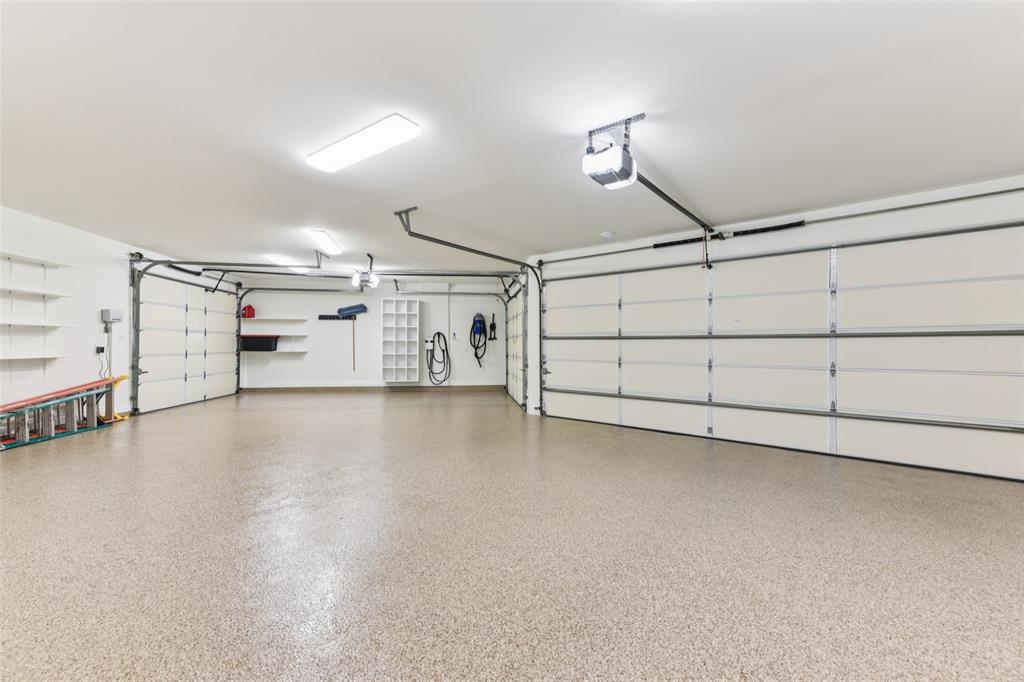 2203 Court Del Rey Round Rock, TX 78681 - Photo 31 of 35 Garage featuring a garage door opener