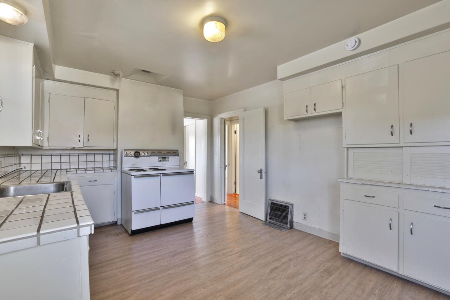 494 Lewis Avenue San Leandro, CA 94577 - Photo 14 of 19 a view of a kitchen with wooden floor
