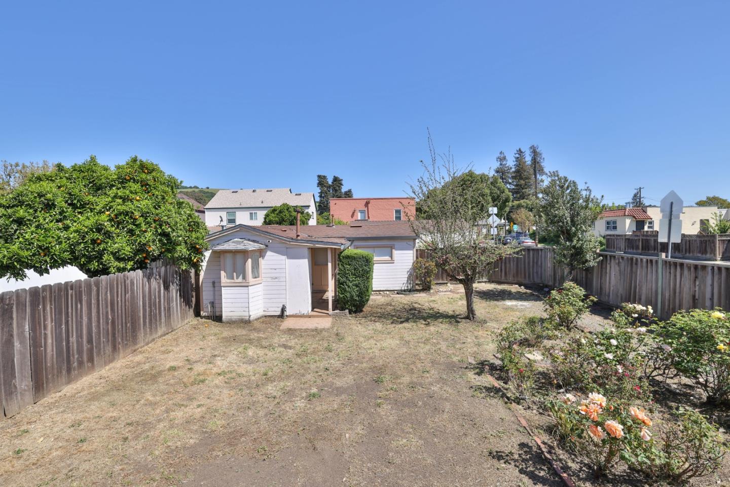 494 Lewis Avenue San Leandro, CA 94577 - Photo 16 of 19 a view of a house with a yard and fence