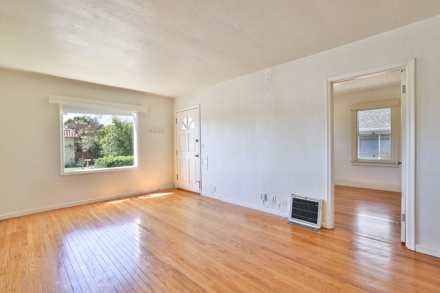 494 Lewis Avenue San Leandro, CA 94577 - Photo 10 of 19 a view of empty room with wooden floor and fan