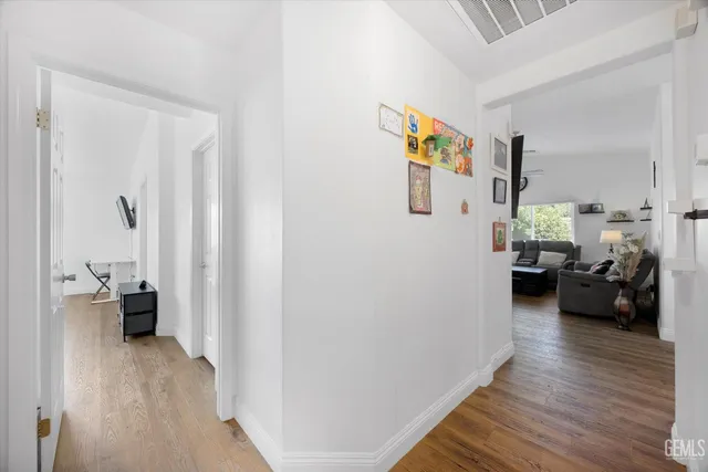 a view of a living room and hardwood floor