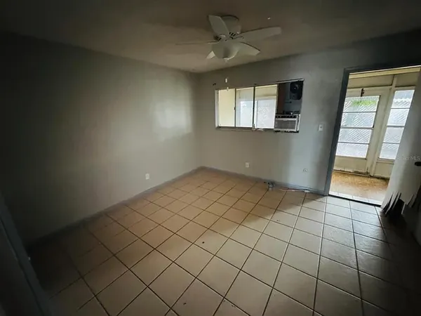 a view of an empty room and window