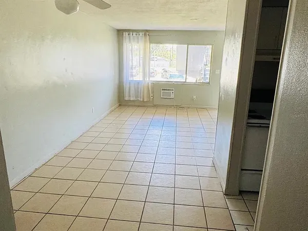 a view of an empty room and window