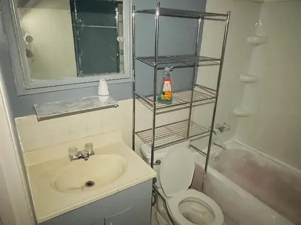 a bathroom with a sink and a shower