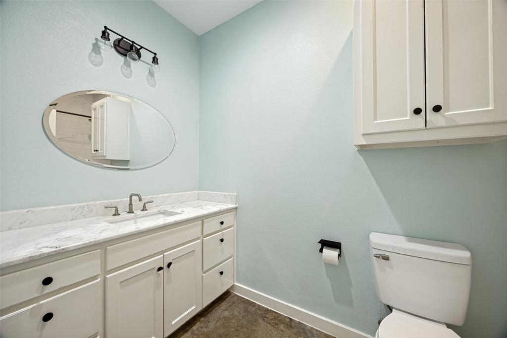 822 Private Road 7370 Point, TX 75472 - Photo 23 of 30 Bathroom featuring a single vanity with stone countertop, undermount sink, and brushed nickel faucet