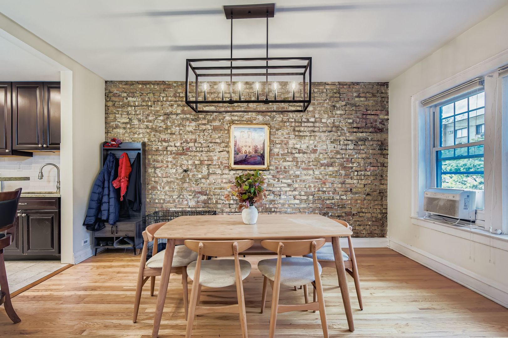 539 West Addison Street, Unit 2N Chicago, IL 60613 - Photo 13 of 23 a dining room with fireplace furniture and wooden floor