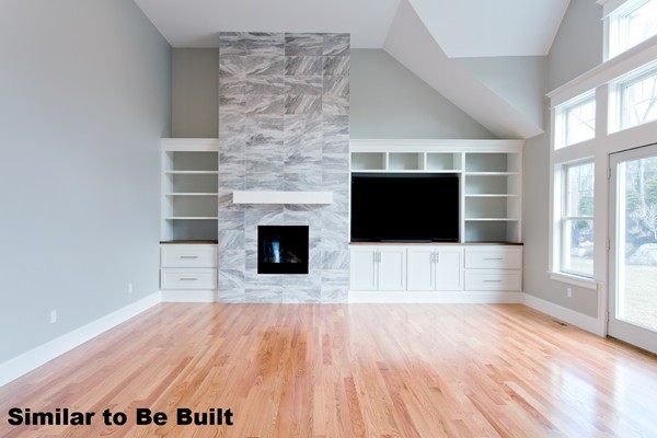 23 Covered Bridge Lane Wayland, MA 01778 - Photo 5 of 11 a view of empty room with wooden floor and fireplace