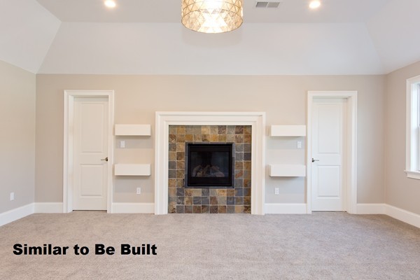 23 Covered Bridge Lane Wayland, MA 01778 - Photo 6 of 11 a view of a livingroom with a fireplace and window