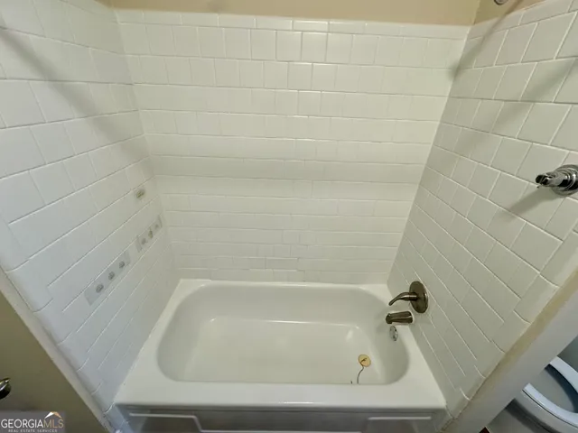 a close up of a bathtub in a bathroom
