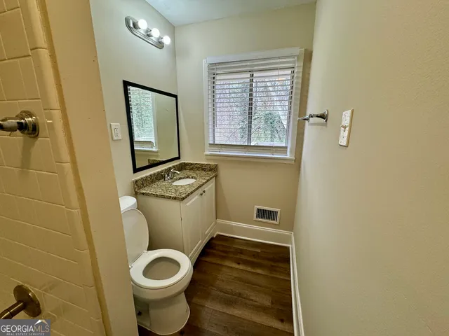 a bathroom with a toilet and a sink