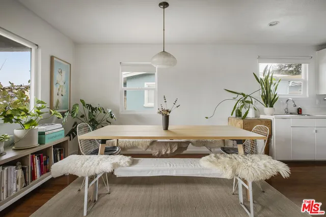 a very nice looking dining room with a table and chairs