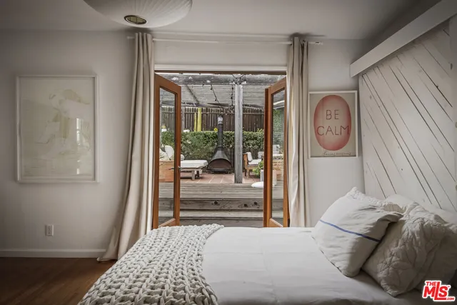 a view of a house with wooden floor and wooden fence