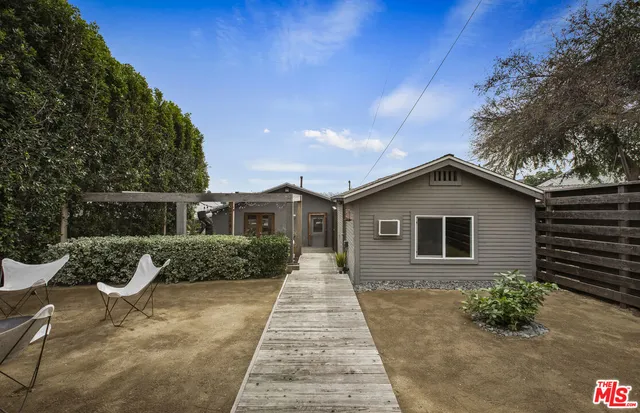 a view of an chairs and tables in patio