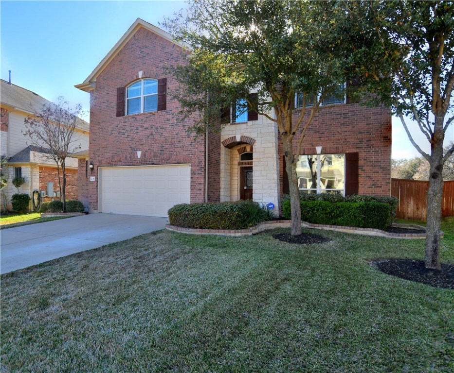 231 Fort Mabry Loop Georgetown, TX 78628 - Photo 1 of 1 a front view of a house with garden