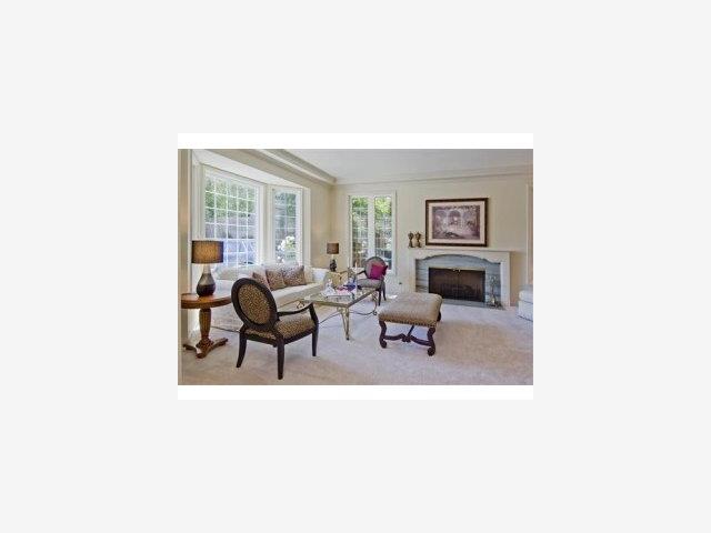 100 Crystal Springs Road Hillsborough, CA 94010 - Photo 2 of 9 a living room with furniture and a fireplace