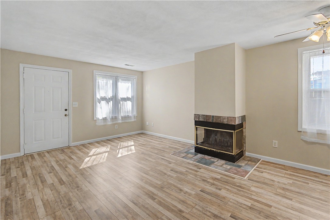 3399 Post Road, Unit 14 Warwick, RI 02886 - Photo 3 of 23 LIVING AREA WITH WOOD FIREPLACE