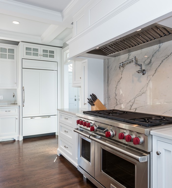 821 Ridge Road Wilbraham, MA 01095 - Photo 5 of 30 a kitchen with wooden floor and white cabinets