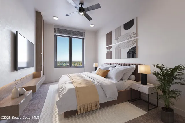 a bedroom with bed and a large window