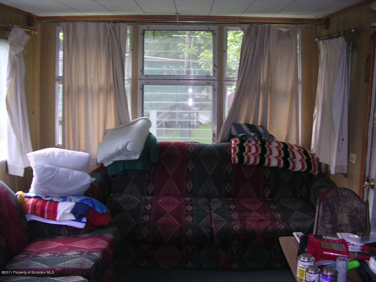 River Road Meshoppen, PA 18630 - Photo 2 of 7 a living room with furniture and a large window