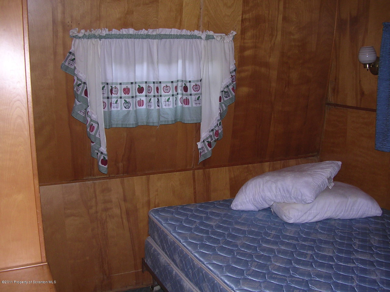 River Road Meshoppen, PA 18630 - Photo 4 of 7 a bedroom with a bed and a wall painting