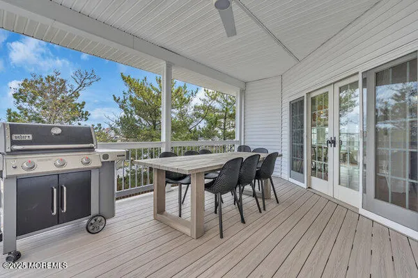 a view of a patio with wooden floor