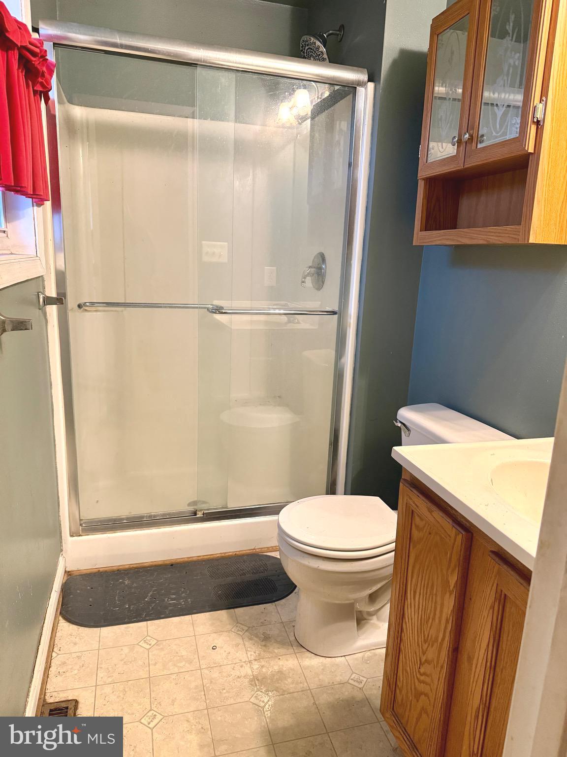 52 Morgan Street Inwood, WV 25428 - Photo 14 of 26 a bathroom with a toilet and a shower