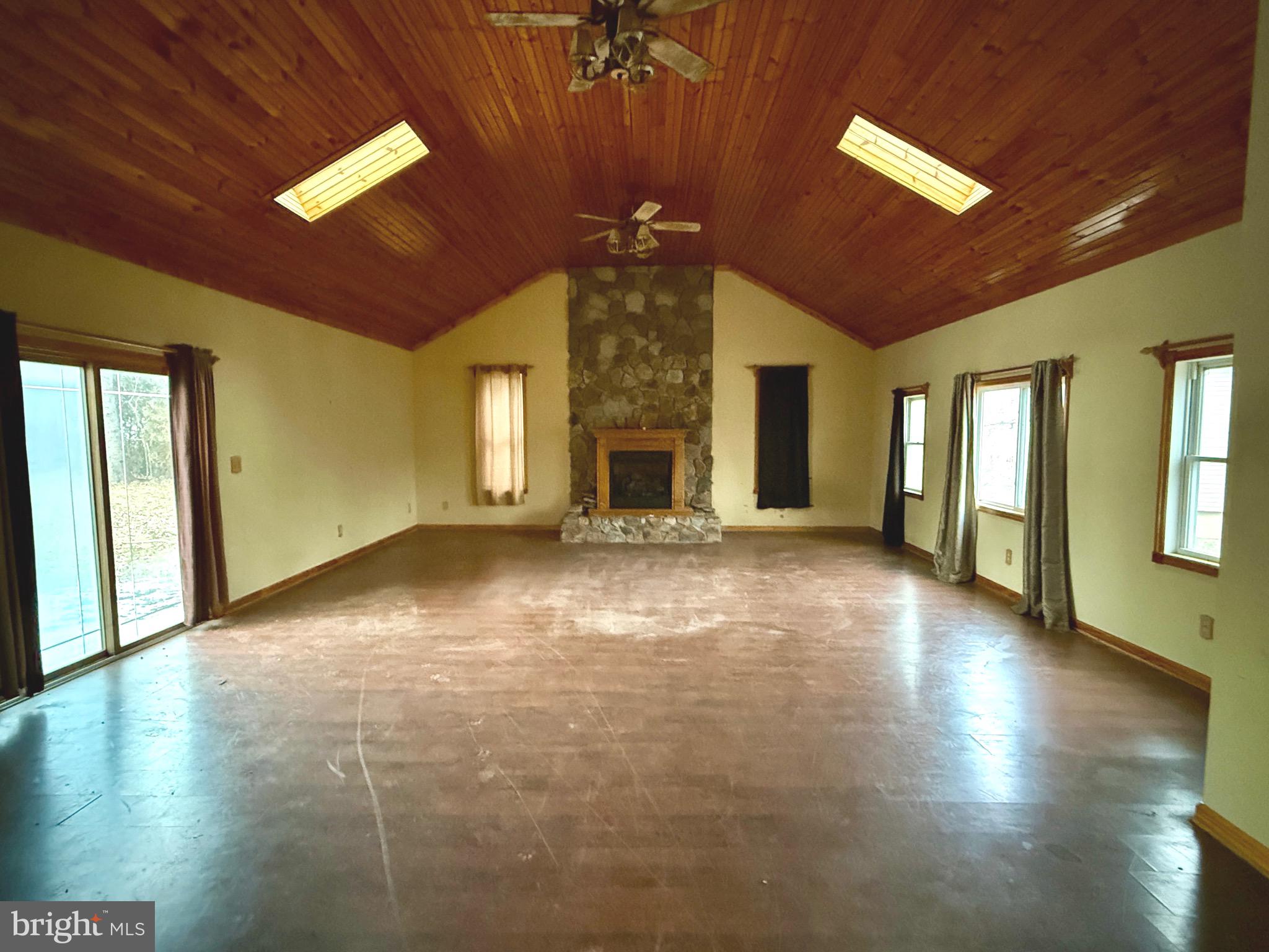 52 Morgan Street Inwood, WV 25428 - Photo 19 of 26 a view of an empty room with a window and fireplace