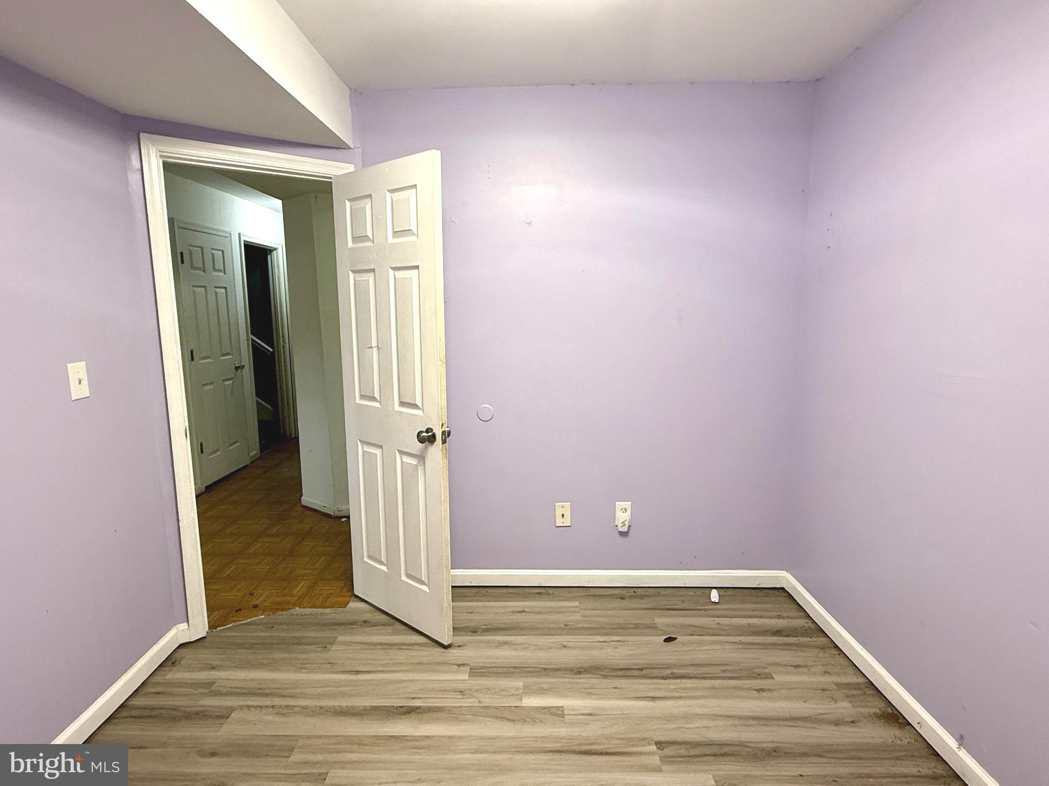 52 Morgan Street Inwood, WV 25428 - Photo 24 of 26 a view of a livingroom with wooden floor and a bathroom